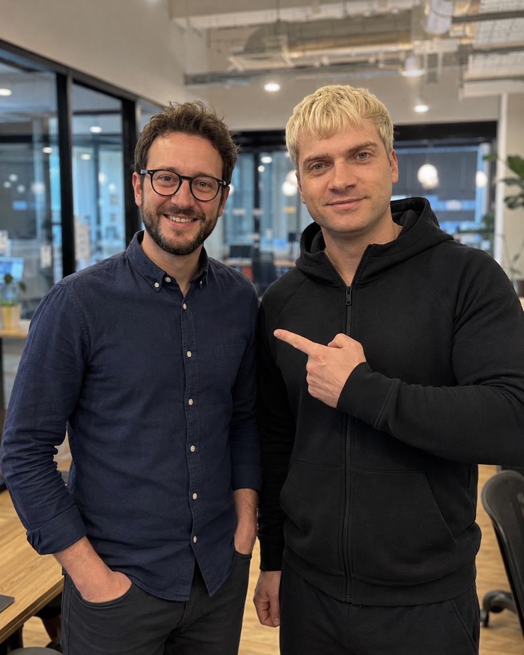 Lucas Weaver with a software professional in a modern office.
